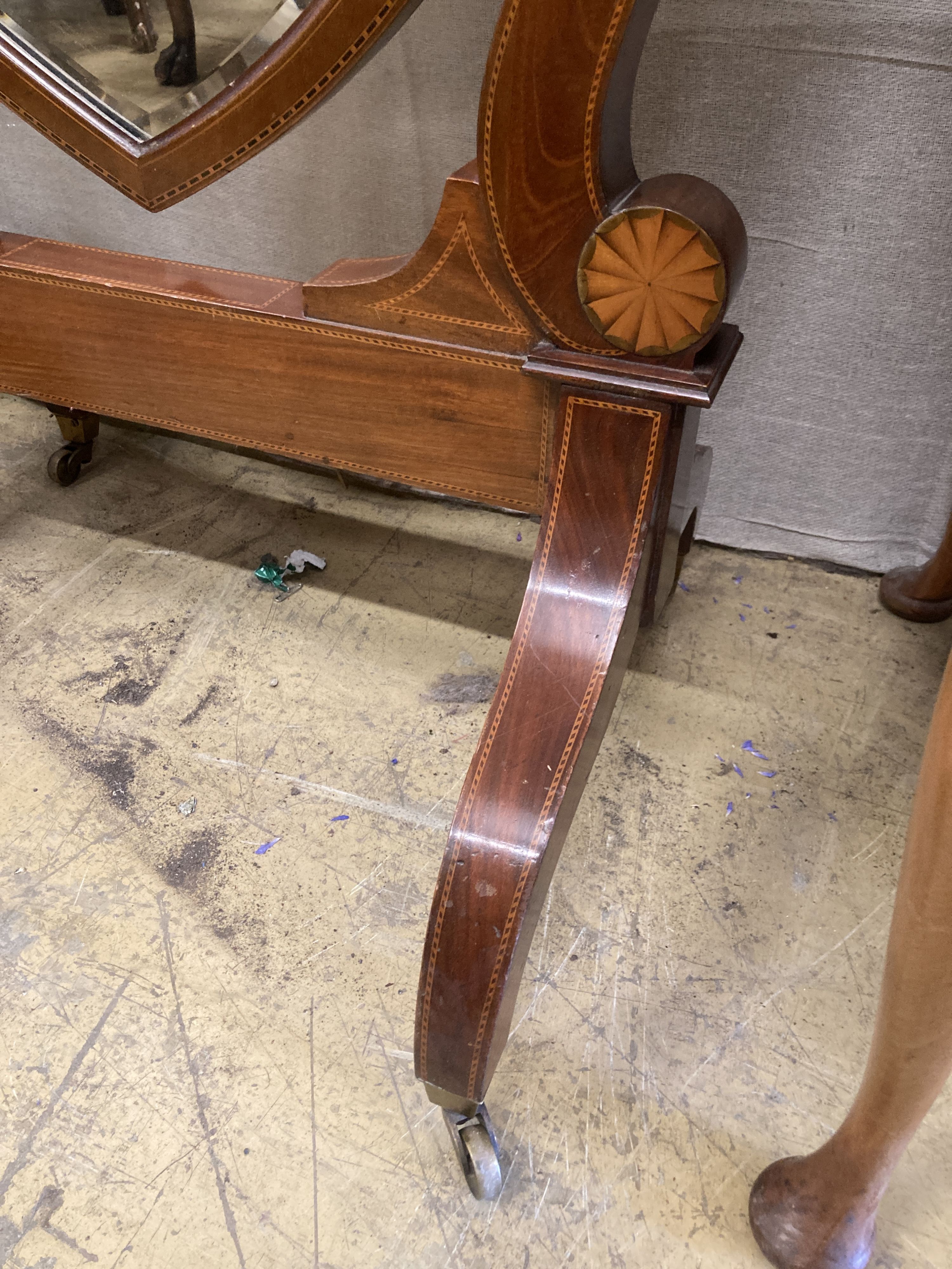 A large Edwardian inlaid mahogany shield shaped cheval mirror, width 80cm, height 177cm